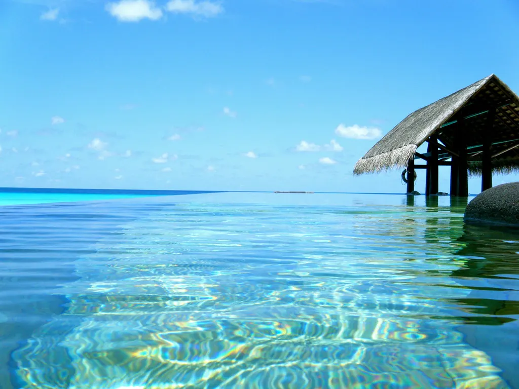 An over-water pavilion on turquoise water